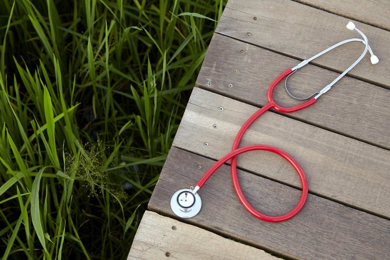 stethoscope red on wood, Concept, Doctor or medical volunteers to visit elderly people in rural Asia