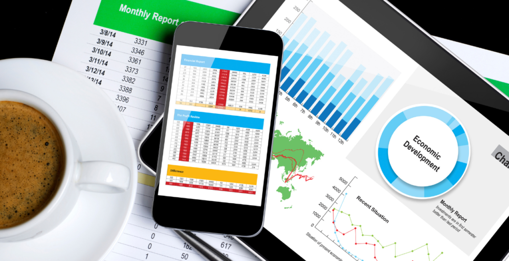 Computer and phone screen showing components of a revenue cycle dashboard