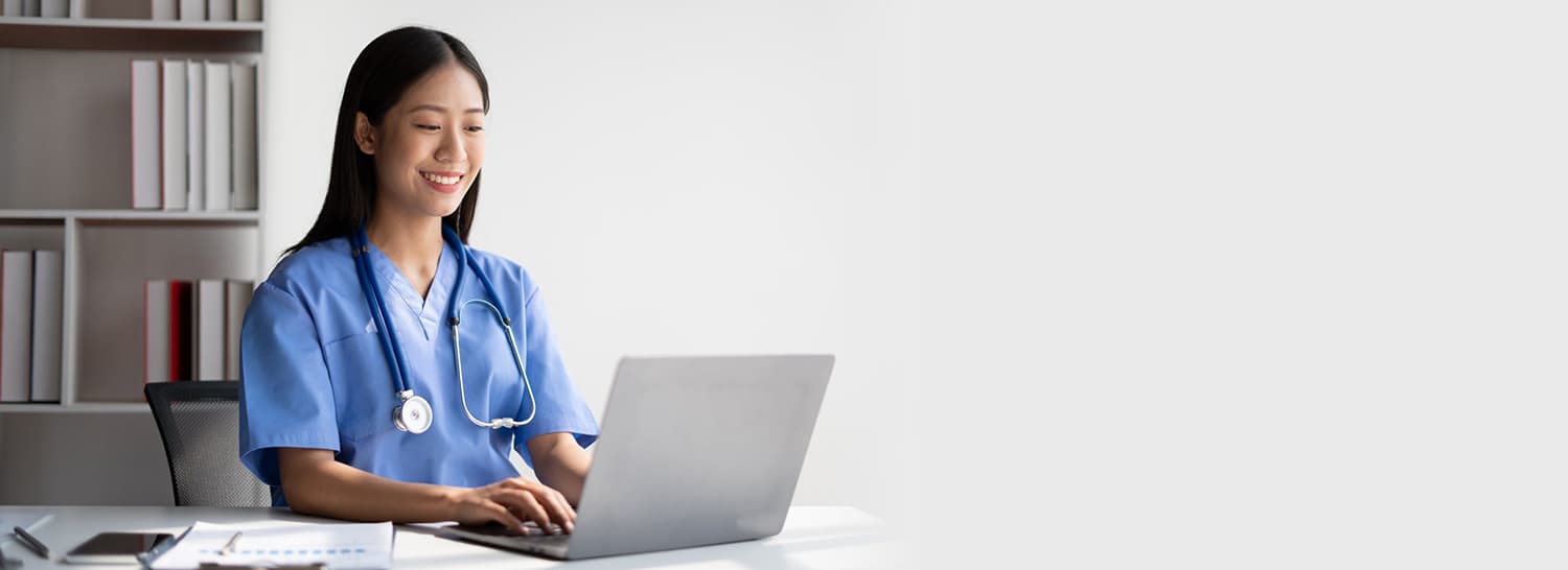 Doctor Using Azalea Health Record on Laptop