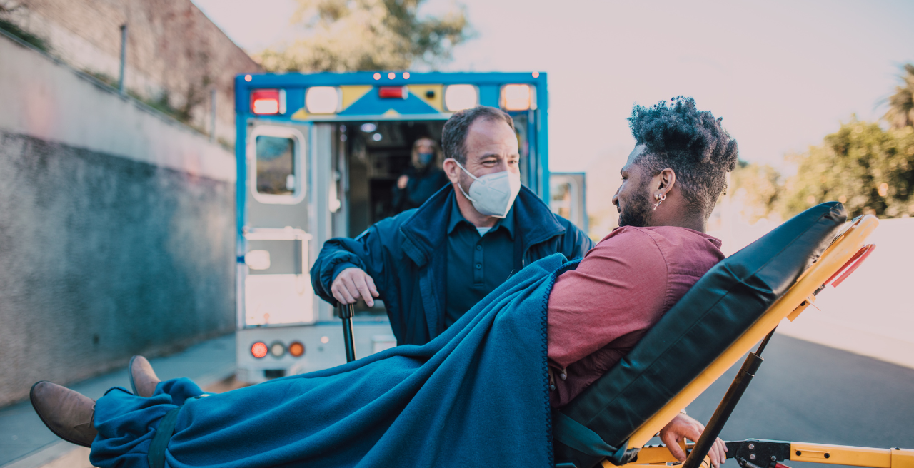 Man on stretcher arriving at rural emergency hopsital